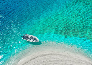 Aerial View of a Boat near the Beach Canva Pro Aerial View of a Boat near the Beach Canva Pro