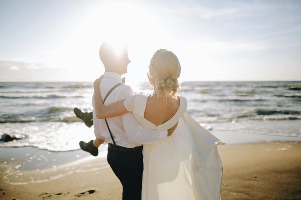 Couple on the beach on their wedding day thailand pexel Couple on the beach on their wedding day thailand pexel