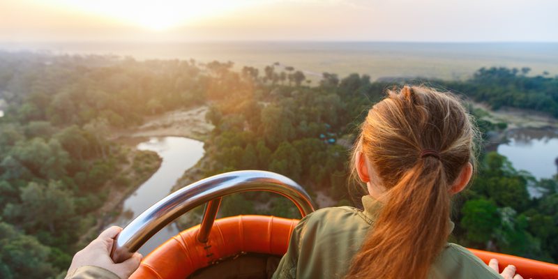 Girl hot air ballooning in the Masai Mara Girl hot air ballooning in the Masai Mara