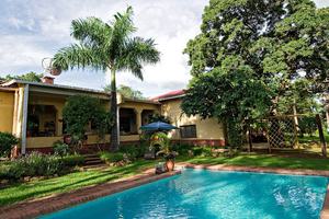 Heuglins Lodge Swimming Pool And Lush Gardens