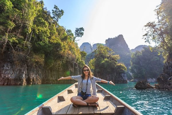 Karsts in thailand woman on a boat Karsts in thailand woman on a boat