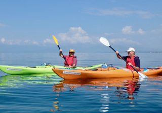 Kayaking On The Blue Waters Of Lake Kivu