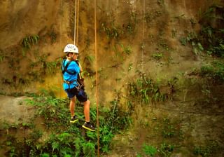 Kid rappelling in Costa Rica Kid rappelling in Costa Rica