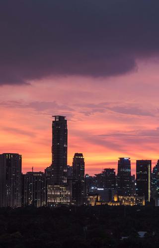 Manila city skyline sunset Philippines min