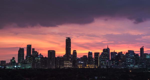 Manila city skyline sunset Philippines min