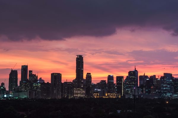 Manila city skyline sunset Philippines min Manila city skyline sunset Philippines min