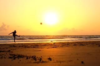 Ngwesaung beach sunset ball kicking Myanmar