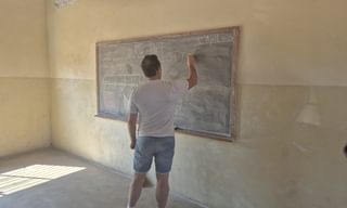 Olly teaching Katubya Community School Play it Forward Zambia by Anna Campbell Olly teaching Katubya Community School Play it Forward Zambia by Anna Campbell