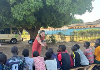 Renata writing a book with the kids at Play it Forward Zambia Renata writing a book with the kids at Play it Forward Zambia