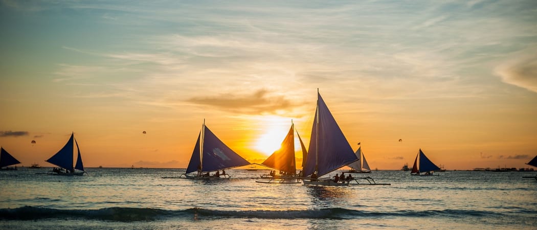 Sailboats at sunset Boracay Philippines