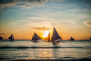 Sailboats at sunset Boracay Philippines