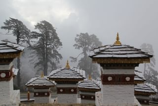 Snow on the Memorial Chortens of Dochula Pass in Thimphu Bhutan Snow on the Memorial Chortens of Dochula Pass in Thimphu Bhutan