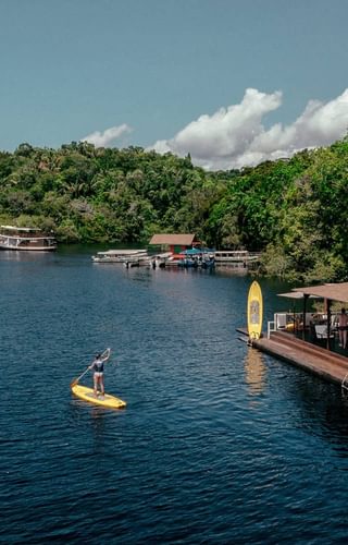 Stand up paddleboarding Anavilhanas Lodge Amazon Brazil Stand up paddleboarding Anavilhanas Lodge Amazon Brazil