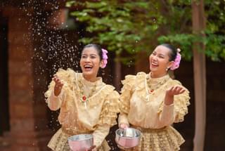 Thai ladies celebrating Songkran in traditional dress Thailand