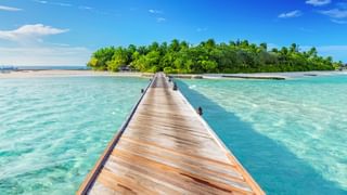Wooden jetty towards a small island in Maldives Canva Pro Wooden jetty towards a small island in Maldives Canva Pro