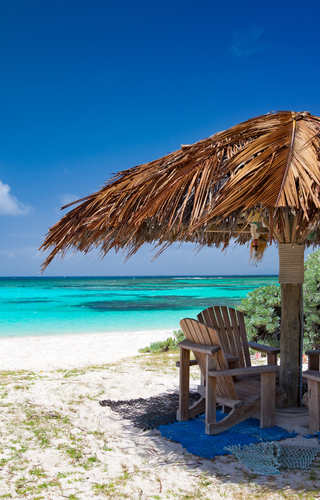 Chairs on the beach in Anegada Canva Pro