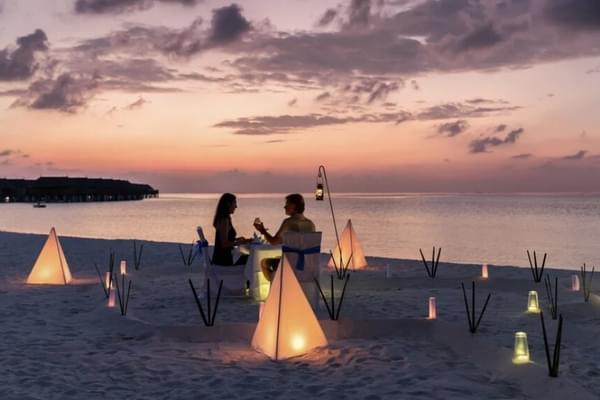 Couple on beach at night thailand canva Couple on beach at night thailand canva