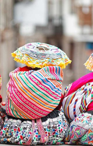 Three women in tradtional Peruvian clothing Cusco City Peru