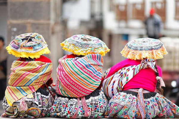Three women in tradtional Peruvian clothing Cusco City Peru Three women in tradtional Peruvian clothing Cusco City Peru