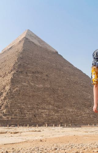 Tourist in front of Pyramid of Giza Cairo Egypt