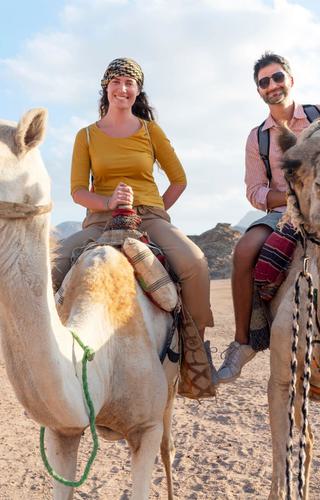 Couple riding Camels Canva Pro