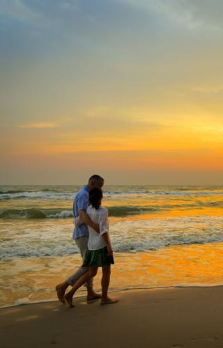 Couple walking on the beach in thailand
