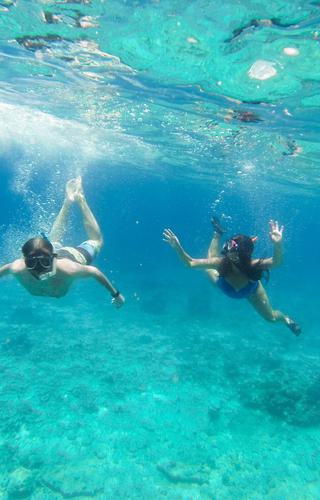 Couple scuba diving in Cebu Philippines