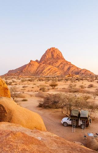 Discover trip ideas to Namibia with stunning deserts wildlife safaris and unique landscapes like Sossusvlei and Etosha National Park canva pro
