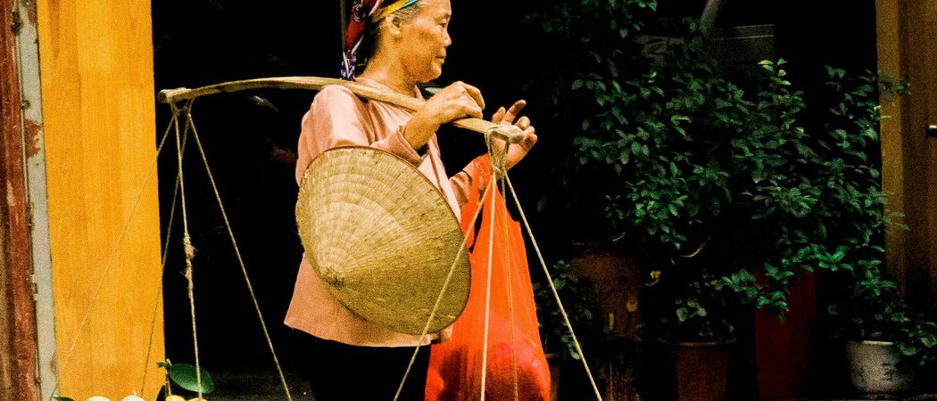 Woman walking through the street hanoi vietnam